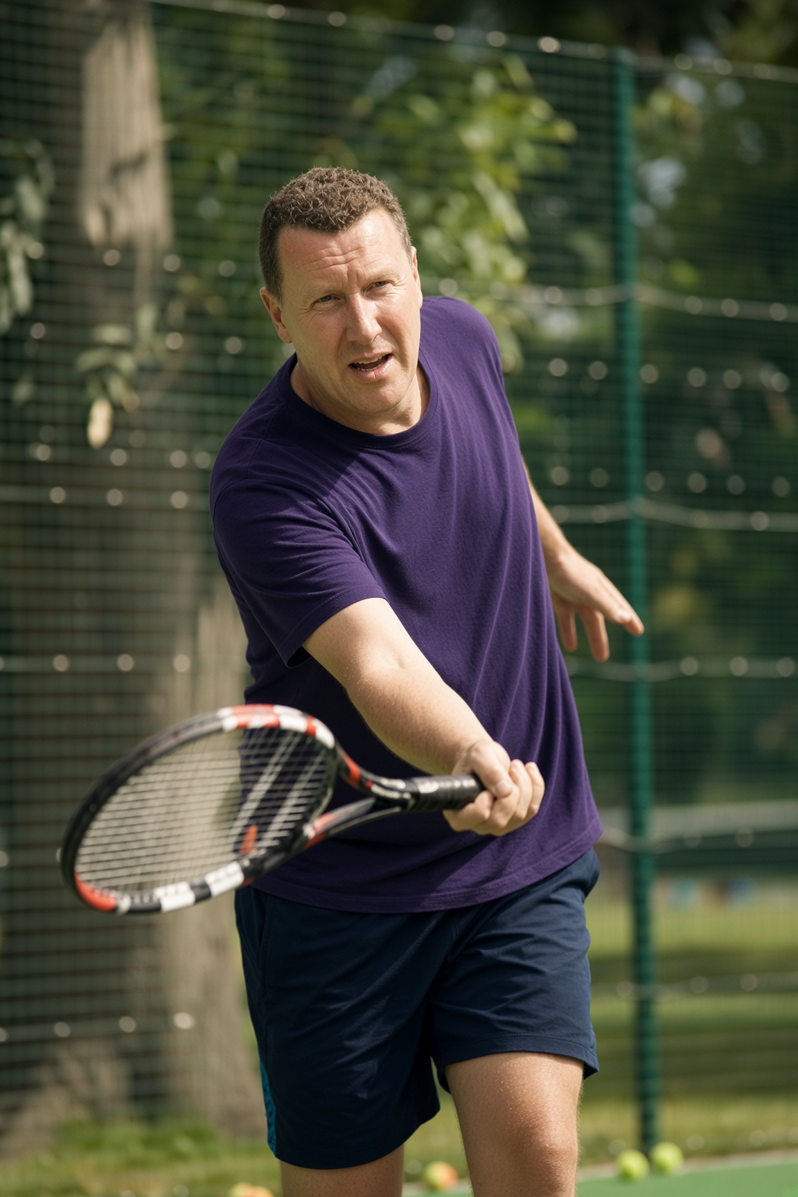 Andrew playing a forehand on an outdoor tennis court